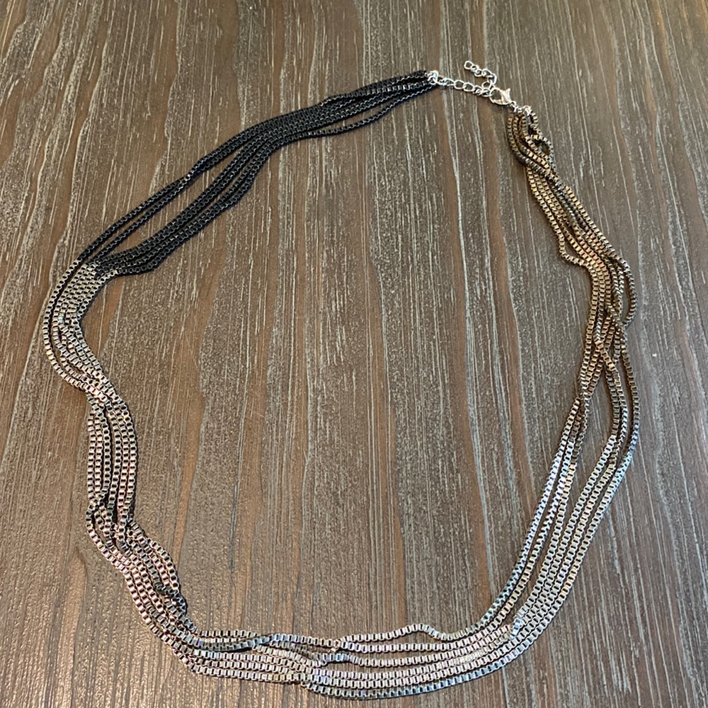 Beautiful Lia Sophia multi strand necklace in gold, silver and black tones.